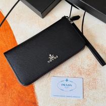注目 PRADA コピー 財布 サフィアーノレザー ロゴプレート ラウンドジップ 長財布 プラダ